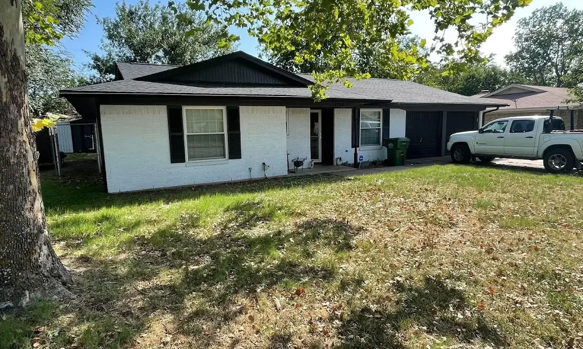 Professional roofing crew working on a residential roof in Nephi